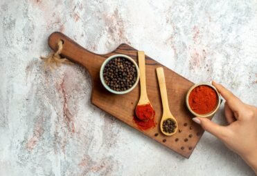 top-view-hot-pepper-spicy-edgy-ingredients-white-space